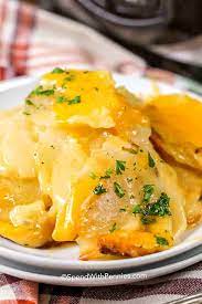 Spoon 1/2 of the potato mixture into a crock pot sprayed with cooking spray. Slow Cooker Cheesy Scalloped Potatoes Spend With Pennies