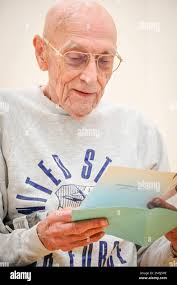 Retired Maj. Gen. Thomas Rew reads a birthday card given to him by friends  he has made at Fort Jackson' Perez Fitness Center. Several friends and  Family members met a t the