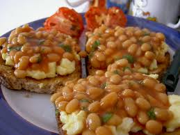 Add a hot dog to each bun and top with about 3 tablespoons of baked beans. Baked Beans Wikipedia