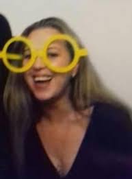 Hi Might be a difficult one please can someone take the yellow party  glasses of my head. Brown eyes Make it clearer Thanks in advanced x 💐💐