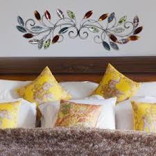 Made from durable metal with a distressed blue and brown finish, this leaf decor is simple yet striking. Stratton Home Decor Over The Door Blowing Leaves Wall Decor S01356 The Home Depot