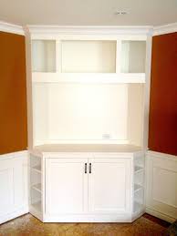 Large corner cabinets can take up a lot of space but its size can be used to its advantage. White Corner Television Unit With Upper Display Shelves And Lower Cabinets Corner Tv Unit Corner Tv Corner Tv Cabinets