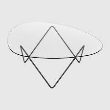 The base appears to be made of a real wood (possibly pine or something lightweight) with a veneer over it, and the glass is about half as thick as an authentic triangle table, but it holds up well and looks great. Contemporary Coffee Table Pedrera Gubi Glass Metal Base Triangular