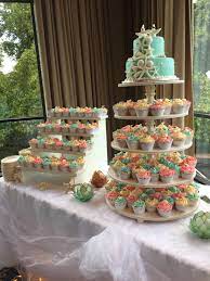 Wedding Cake Sea Stars Made Out Of Fondant Seafoam Green Coral And Tan Beach Themed Beach Theme Wedding Cakes Beach Wedding Cupcakes Beach Wedding Cake