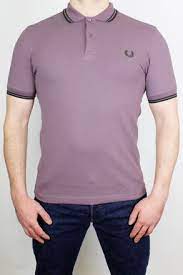 Crafted from fine piqué cotton, the short sleeved shirt is made in england to a simple, elegant shape designed to flatter. Fred Perry Polo Shirt Twin Tipped Black Gold Aubergine 80 00