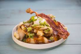 Poutine is a popular canadian fast food dish that is made with french fries that are covered in cheese curds and gravy. 20 Tastiest Ways To Eat Poutine Food Network Canada