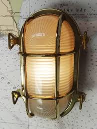 Nautical lamps, nautical wall lights, door bells, door knockers and more inspirational ideas to create that perfectly themed design. Oval Brass Bulkhead Light New Skipjack Nautical Wares Bulkhead Light Nautical Lamp Shades Bulkhead Lights