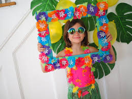 The hibiscus arrangement was free clipart found on the web, and the accompanying swirls were the tiki masks complete the overall theme and the blue wave borders give a tropical beach idea. 20 Easy Luau Ideas For Kids The Chirping Moms