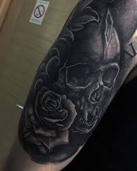 Blue flower tattoo rose tattoo on wrist green flower tattoo covered wrist Top 80 Best Skull And Rose Tattoo Ideas 2021 Inspiration Guide