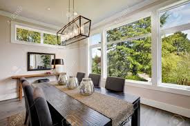Luxurious Modern Dining Room Boasts A Black Dining Table Illuminated Stock Photo Picture And Royalty Free Image Image 89399295