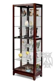 The most straightforward way is the chronological format. Hoot Judkins Furniture Howard Miller Luke Contemporary Display Curio Cabinet With Sliding Door In Cherry Bordeaux Finish