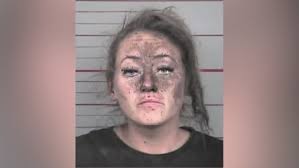 Woman arrested after first responders find her hiding inside the walls of a  business, police say