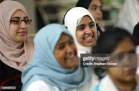 Abeer Khan 25, right rear, of Chatsworth, laughs during a... News Photo