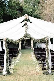 Outdoor Wedding Ceremony White Fabric And Greenery Arches Blue Ribbon Weddings Outdoor Wedding Decorations Outdoor Wedding Wedding Ribbon