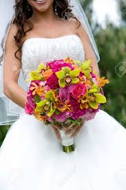 When it comes to red wedding flowers, the color combinations are seemingly endless. A Bridal Bouquet In Red Pink Green And Orange Stock Photo Picture And Royalty Free Image Image 13162450