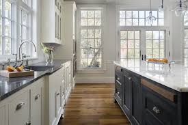 White Perimeter Cabinets With Soapstone Counters Dark Blue Island Cabinets With Carrera Marble Counters Rec Kitchen Remodel Kitchen Design Kitchen Renovation