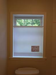 Frosted glass bathroom windows a common way to add privacy to any window is by adding frosted glass. Neat Bathroom Privacy Idea Lower Shade Tension Rod Bathroom Window Treatments Simple Bathroom Pictures For Kitchen Walls