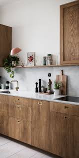 We Love The Simple Wooden Units In This Kitchen The Look Is Minimalist But Effective Scandinavian Kitchen Cabinets Kitchen Interior Kitchen Marble