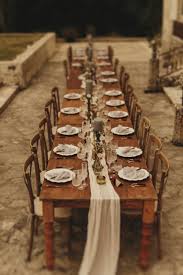 Rustic Wooden Tables With Ruffled Cheesecloth Runner In Pale Grey Country Chateau Dining Scene Fo Rustic Wooden Table Wooden Table Decor Table Runners Wedding