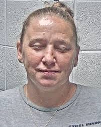 Woman arrested following crash that dragged juvenile under truck