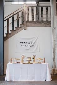 Wedding cake table idea with beautiful fabric draping backdrop + champagne and lush garden details + candlelight backyard celebration. 25 Inspiring Wedding Cake And Dessert Tables Onefabday Com