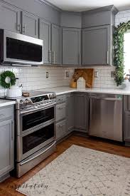 Gray Kitchen Cabinets Subway Tile Backsplash And Stainless Steel Farmhouse Sin Kitchengarden Gardenflowers Garden Kuchenrenovierung Graue Kuche Kuchendesign