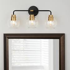 You'll change the bulbs less often and save on your electricity bill all at the same time. Home Decorators Collection Lawrence 3 Light Aged Bronze And Brass Vanity Light Hd 1861ab The Home Depot Brass Vanity Light Vanity Lighting Vanity Light Bar