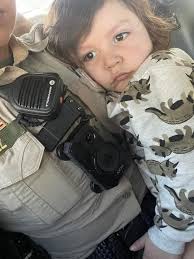 I'm Desperately trying to find the parents of this sweet girl I picked up  wandering the streets near the park . She is approximately 2-3 years old!.  She said her name is