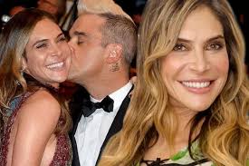 Robbie Williams pays tribute to his long-time manager David Enthoven: 'He  was my hero'