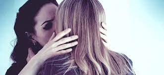 Happy young handsome father sitting on sofa, holding on lap small children daughters, enjoying tender sweet moment at home. The House Of The Lesbian Kiss Lesbians Kissing Bo And Lauren Girls Making Out