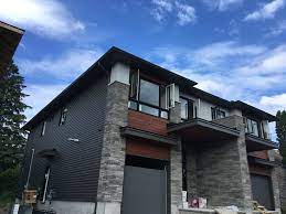 Color clear through is the gentek color system that is not a paint applied to the top layer, but rather is infused throughout the panels. Gentek On Twitter Great Example Of How Vinyl Siding Can Work Along Side Stone And Faux Wood Cladding Gentek S Windswept Smoke Colour Looks Great Gentekcanada Https T Co Jq17zybxtd