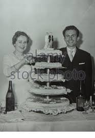 For instance, fifty years of marriage is called a golden wedding anniversary. Newlyweds With Wedding Cake 60s 2 Stock Photo Alamy