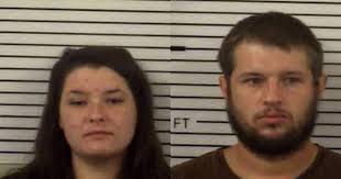 Couple arrested after keeping baby locked in cage 23 hours a day, police  say