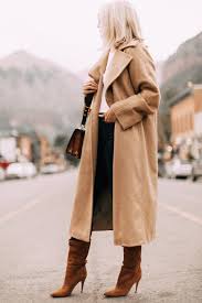 It's made from soft camel hair with a plush handle and has a loose fit that's perfect for layering over a chunky sweater. This Camel Wrap Coat Will Elevate Any Look This Winter