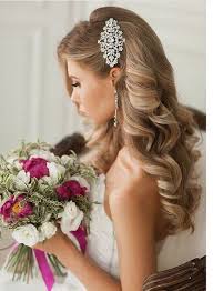 Long wavy hair is a sophisticated choice for wedding hairstyles that must include a veil. Wedding Hairstyles That Are Right On Trend Modwedding Romantic Wedding Hair Glamorous Wedding Hair Hair Styles