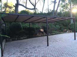 hv creation a realise en metal acier cet abri de voiture appele egalement carport pour un particulier dans l abri voiture toile ombrage maisons exterieures