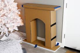 The 10 foot tree build began with the trunk. How To Make A Cardboard Holiday Fireplace Hgtv