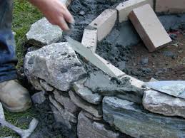 I want to build a rock retaining wall, but have no clue where to start. How To Set Stones For A Fire Pit How Tos Diy