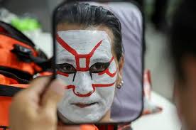 Syndication: Detroit Free Press Ken Dick, of Berkley, wrestling as the  Great Akuma prepares for his