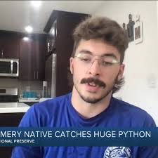 Cincy native nabs huge python in south Florida