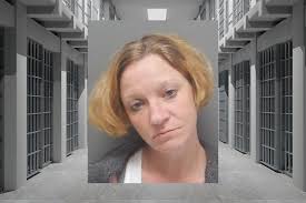 An Eros woman arrested after shooting a man through a bathroom door