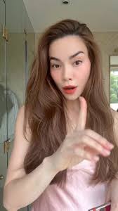 Ms Ho Ngoc Ha in ANNA DO satin dress