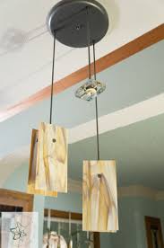 Change out that old fluorescent light with a diy pendant light above the sink. Diy Glass Pendant Lights Designed Decor