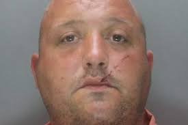 Hammer-wielding yob threatened to kill his neighbour before smashing her  windows and fighting her son