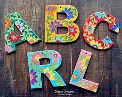 The letters are divided into sections, which can be colored differently. Ceramic Letters Custom Name Sign Personalized Gift Alphabet Etsy Painted Letters Alphabet Art Decorative Letters