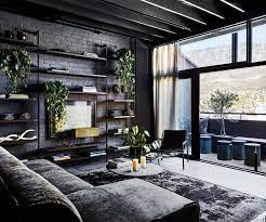 An Industrial Style Apartment With A Dark And Moody Monochrome Palette Homes To Love Industrial Interior Design Brick Living Room Brick Wall Living Room