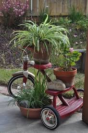 Don T Get Rid Of That Old Tricycle Till You See This Page 2 Of 2 Wise Diy Garden Containers Garden Projects Garden Junk