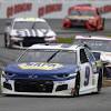 At the start of the nascar race, keep your eye on the flagman (a nascar official), who is perched above the race track at the start/finish line in a crow's nest of sorts. 1