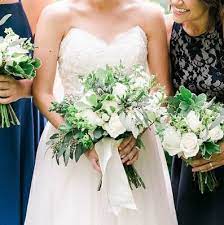 White wedding flowers with greenery. Classic