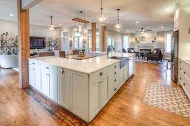 White Cabinets And White Counter Tops Custom Kitchen Island With Booth In The Middle Open F Custom Kitchen Island Open Floor Plan Kitchen Kitchen Floor Plans